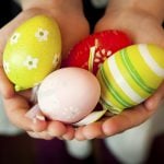 Child Hands Holding Colorful Easter Eggs